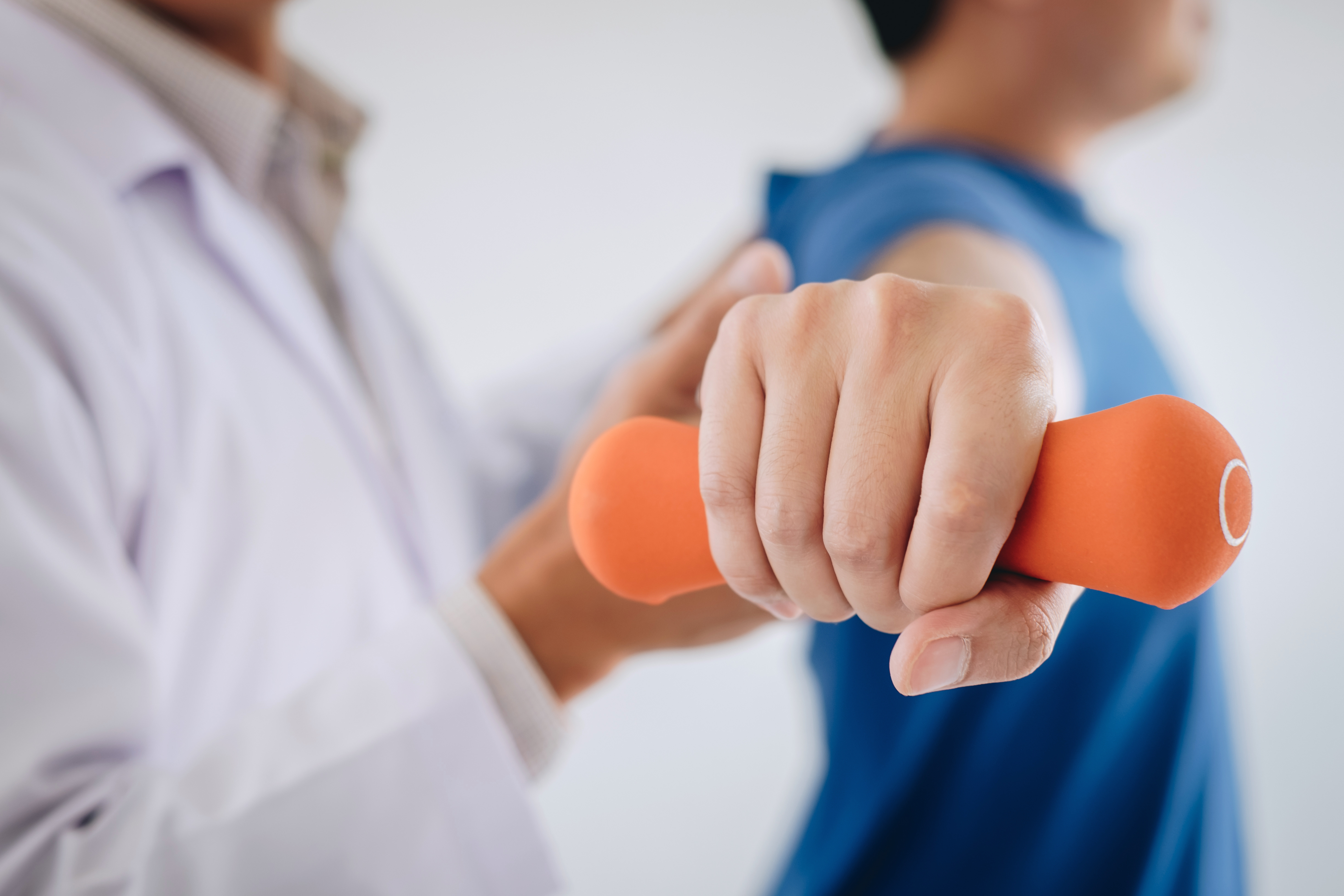 Professional physical therapist working with a patient during a rehabilitation session